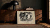 Santa Claus watching a sleeping child print in a black frame leaning against a walnut console in lamplight