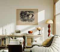 Santa Claus watching a sleeping child print in an oak frame above a mid-century book console with a vintage radio