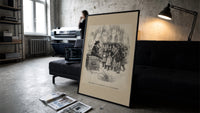 Santa Claus on Christmas box with children print in a slim black frame leaning on a dark sofa in a concrete print studio