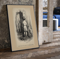 Small child seen from behind undressing print in a black frame leaning beside a vintage door on parquet