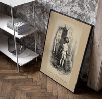 Small child seen from behind undressing poster in a black frame leaning beside a shelf in a raw-plaster loft