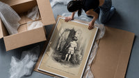 Small child seen from behind undressing framed print being unpacked from protective bubble wrap and a box