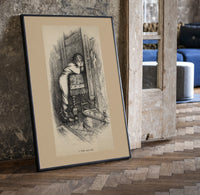 Boy hiding face beside fireplace print in a black frame leaning beside a vintage door on parquet