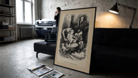 Two children waiting up on Christmas Eve print in a slim black frame leaning on a dark sofa in a concrete print studio