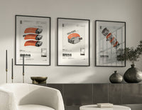 Trio of sushi prints displayed above a sideboard with dark ceramic vases and trailing plants