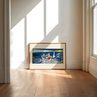 Three Wise Men riding camels toward star print in an oak frame on a sunlit wood floor beneath tall window light