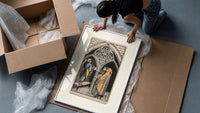Three pentacles tarot cathedral scene framed print being unpacked from protective bubble wrap and a box