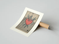 Rolled Heart pierced by three swords poster beside its crush-resistant kraft shipping tube