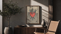 Three of Swords poster framed above a fluted sideboard beside a potted tree