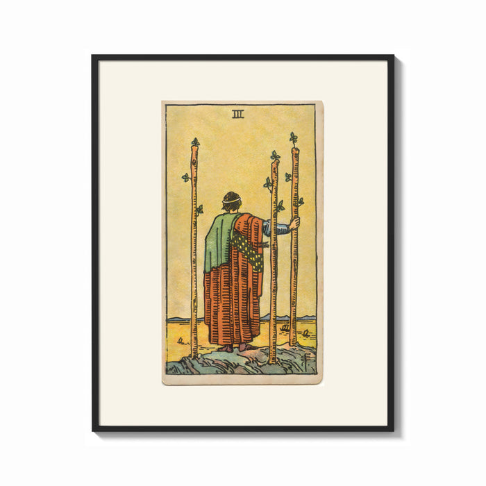 Framed Figure holding staffs facing sea print shown as a bold statement piece on a clean gallery wall