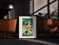 Black-framed Black cats with jack-o-lantern heads print on a moody console with designer coffee-table books