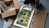 Black cats with jack-o-lantern heads framed print being unpacked from protective bubble wrap and a box