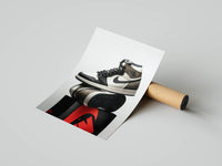 Travis Scott Jordan 1 High OG pair on a black pedestal with red Jumpman logo as a rolled print