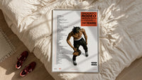 Travis Scott Rodeo Anniversary framed print styled on a bed with sneakers alongside