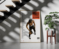 Travis Scott Rodeo Anniversary framed print on a staircase entryway wall beside a plant
