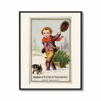 Framed Boy dragging Christmas tree on sled print shown as a bold statement piece on a clean gallery wall