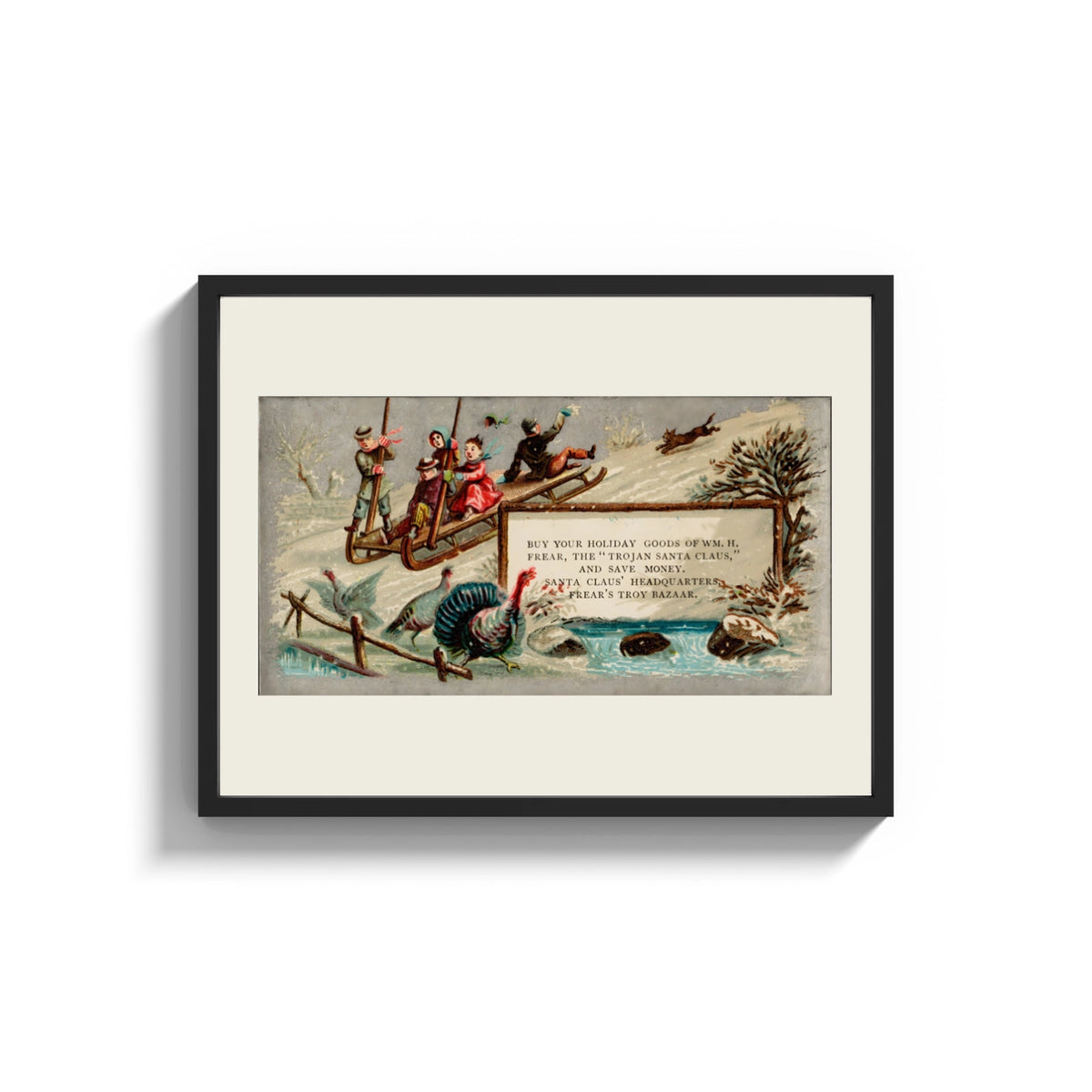 Framed Children sledding downhill past turkeys print shown as a wide statement piece on a clean white wall