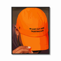 Framed Trusting God Orange Cap print shown as a bold statement piece on a clean gallery wall