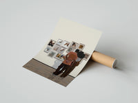 Gently curled Black Couple at a Gallery Wall print beside its protective shipping tube