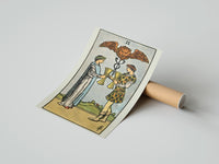 Gently curled Two of Cups print beside its protective shipping tube