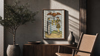 Two of Cups poster framed above a fluted sideboard beside a potted tree