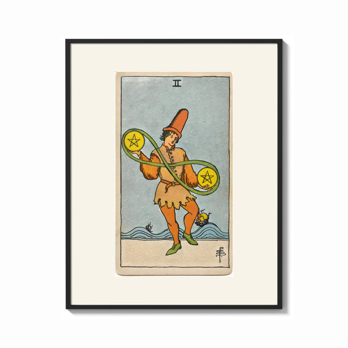 Framed Two of Pentacles tarot figure print shown as a bold statement piece on a clean gallery wall