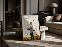 Man with bees on face, back turned print in a black frame leaning on a travertine table in a sunlit lounge