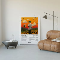 Tyler the Creator Flower Boy poster framed above a tan leather living-room couch