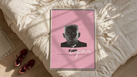 Tyler the Creator IGOR framed print styled on a bed with sneakers alongside