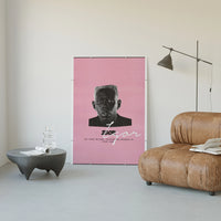 Tyler the Creator IGOR poster framed above a tan leather living-room couch