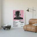 Tyler the Creator IGOR poster framed above a tan leather living-room couch