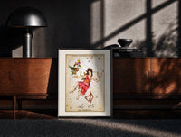Black-framed Andromeda constellation chained woman figure print on a moody console with designer coffee-table books