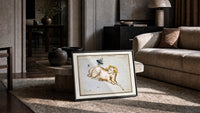 Aries ram and fly constellation chart print in a slim black frame leaning on a travertine coffee table
