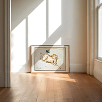 Aries ram and fly constellation chart print in an oak frame on a sunlit wood floor beneath tall window light