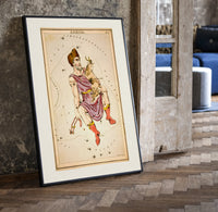 Auriga constellation charioteer holding goat print in a black frame leaning beside a vintage door on parquet