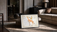 Camelopardalis constellation giraffe with figures print in a slim black frame leaning on a travertine coffee table