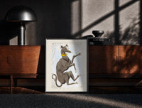 Black-framed Canis Major dog constellation figure print on a moody console with designer coffee-table books