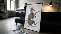 Canis Major dog constellation figure print in a slim black frame leaning on a dark sofa in a concrete print studio
