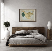 Capricornus sea-goat constellation figure print in a dark wood frame above a rattan bed on a plaster wall