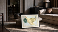Capricornus sea-goat constellation figure print in a slim black frame leaning on a travertine coffee table