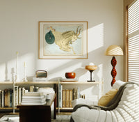 Capricornus sea-goat constellation figure print in an oak frame above a mid-century book console with a vintage radio