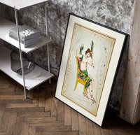 Cassiopeia constellation seated woman figure poster in a black frame leaning beside a shelf in a raw-plaster loft