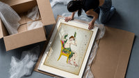 Cassiopeia constellation seated woman figure framed print being unpacked from protective bubble wrap and a box