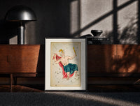 Black-framed Crowned king constellation figure Cepheus print on a moody console with designer coffee-table books