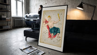Crowned king constellation figure Cepheus print in a slim black frame leaning on a dark sofa in a concrete print studio