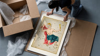 Crowned king constellation figure Cepheus framed print being unpacked from protective bubble wrap and a box