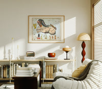 Cetus the whale constellation chart print in an oak frame above a mid-century book console with a vintage radio