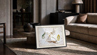 Celestial constellation star chart with animals print in a slim black frame leaning on a travertine coffee table