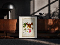 Black-framed Antinous, eagle and dolphin constellations print on a moody console with designer coffee-table books
