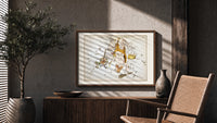 Hercules constellation star map figure print in a wood frame above a fluted sideboard beside an olive tree